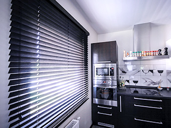 Implementations of wood blinds