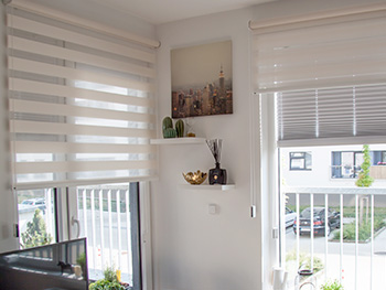 Implementations of double roller blinds